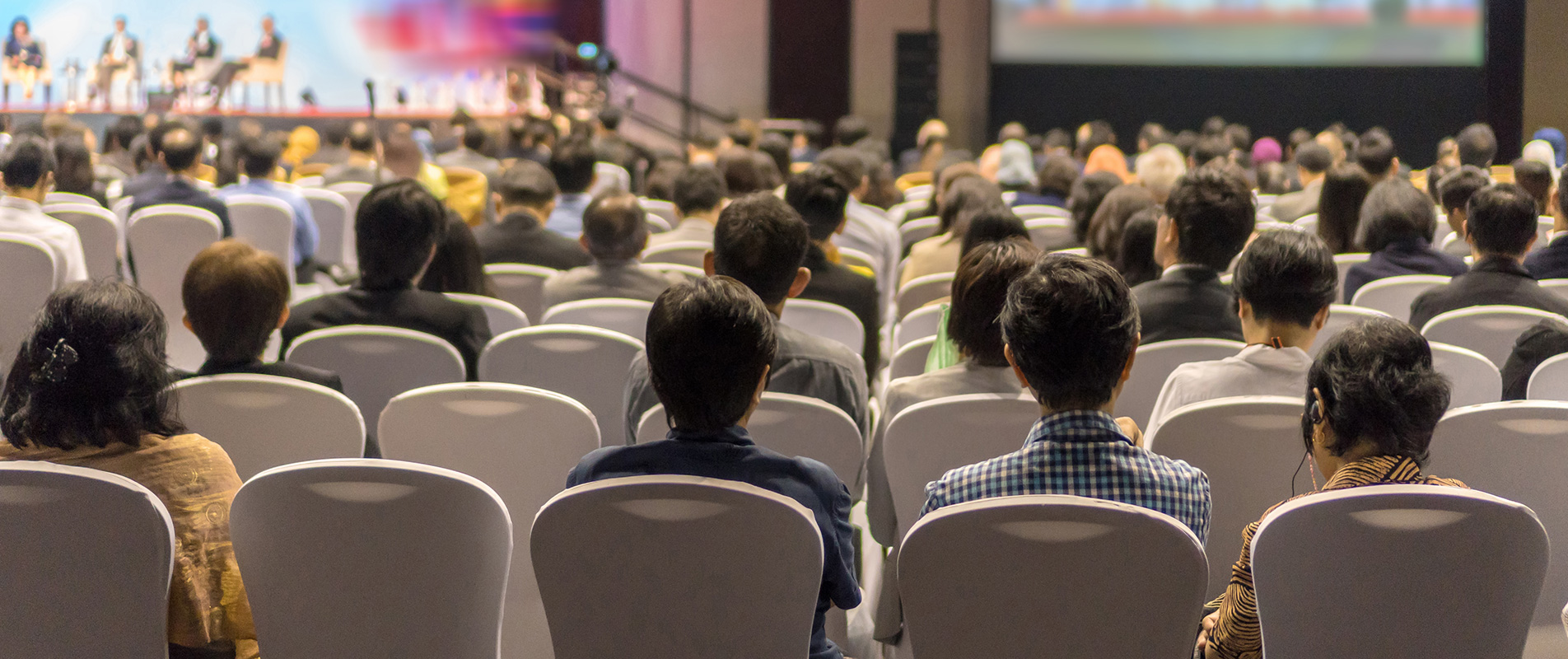 Large group of people in conference seating